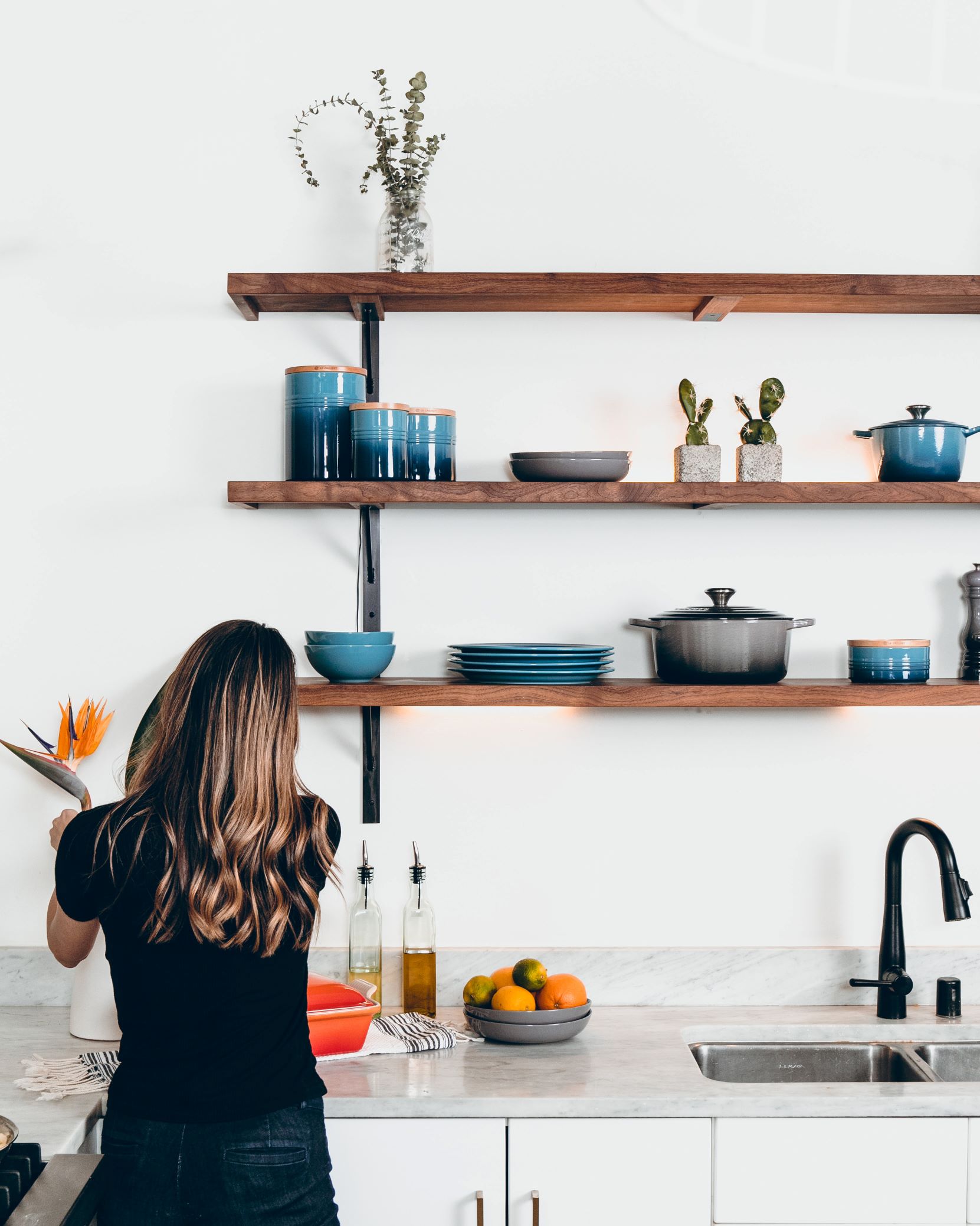 Lady arranging kitchen